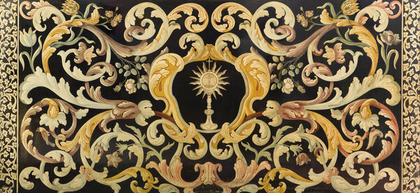 REGGIO EMILIA, ITALY - APRIL 12, 2018: The stone mosaic (Pietra Dura) with the Eucharist on the side altar in church Chiesa di Santo Stefano from 16. - 17. cent.