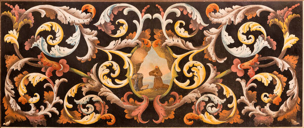 MODENA, ITALY - APRIL 14, 2018: The stone floral mosaic (Pietra Dura) with the St. Francis of Assisi at the prayer in church Chiesa di Santa Maria della Pomposa by Giovanni Pozzoli (1646-1734).