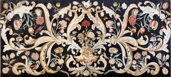 MODENA, ITALY - APRIL 14, 2018: The stone floral mosaic (Pietra Dura)  on the side altar in church Chiesa di San Bartolomeo from 16. - 17. cent.
