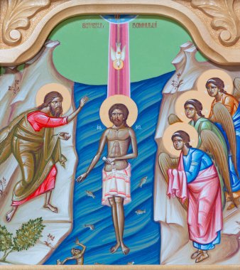 REGGIO EMILIA, ITALY - APRIL 12, 2018: The icon of Baptism of Jesus on the iconostas in church Chiesa di San Giorgio in Reggio Emilia from 20 cent.