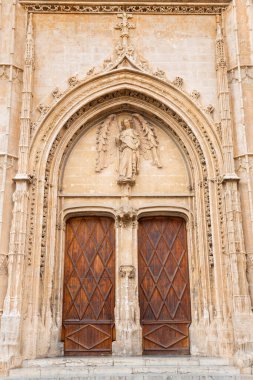 PALMA DE MALLORCA, SPAIN - JANUARY 29, 2019: The portal of La Lonja palace constructed by Guillem Sagrera (1420 - 1452) with the guardian angel statue.