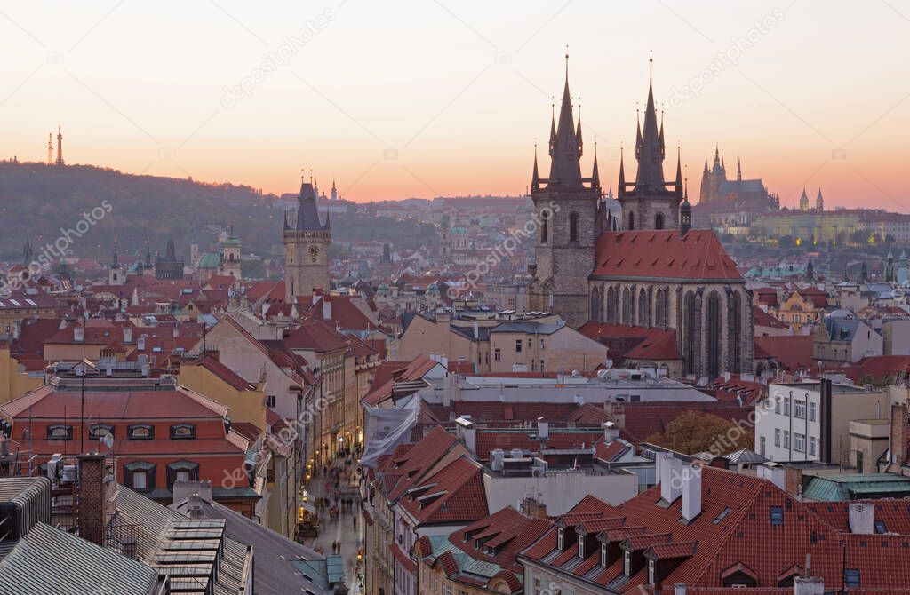 Prague - The City with the Church of Our Lady before Tyn and Castle with the Cathedral in the background at dusk.