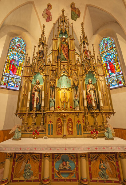 BANSKA BELA, SLOVAKIA - FEBRUARY 5, 2015: The neo gothic altar in the St. John the Evangelist church from end of 19. cent.