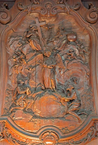 MECHELEN, BELGIUM - JUNE 14, 2014: The carved relief of two slaves with the angel and The Holy Trinity by Ferdinand Wijnants in st. Johns church or Janskerk from 17. cent. — Stock Photo, Image