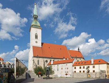 BRATISLAVA, SLOVAKIA - SEPTEMBER 21, 2014: St. Martins cathedral from south and memorial of holocaust. clipart