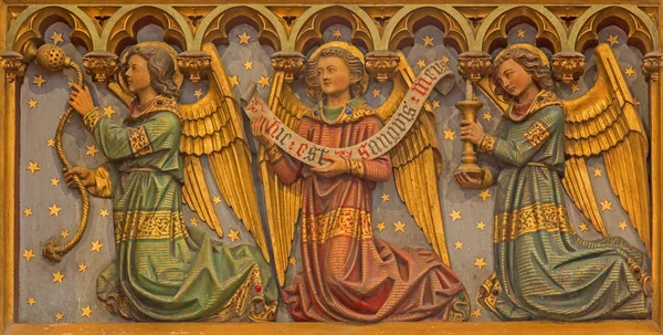 BRUGES, BELGIUM - JUNE 12, 2014: The Carved neogothic relief of angels from side altar in St. Salvator's Cathedral (Salvatorskerk). — Stock Photo, Image