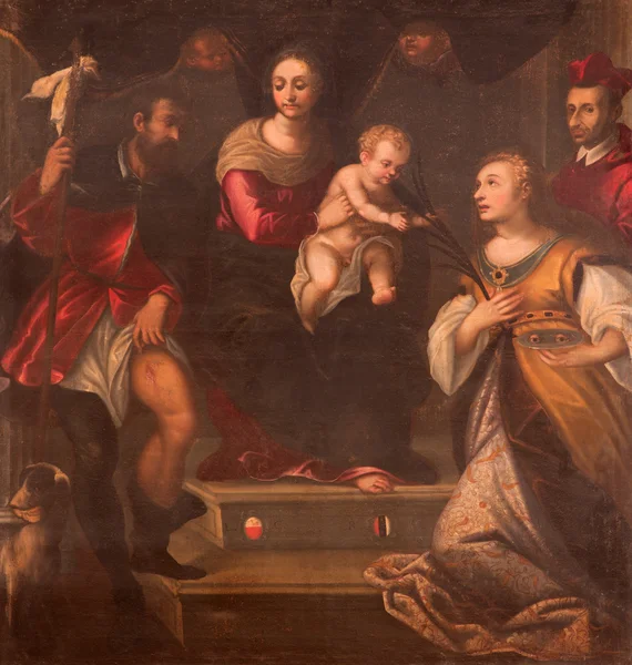 PADUA, ITALIA - 9 SETTEMBRE 2014: La pittura sull'altare maggiore dell'Oratorio di San Rocco. Madonna con i santi di Alesssandro Maganza (1697 ). — Foto Stock