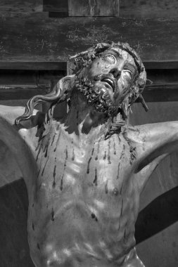 PADUA, ITALY - SEPTEMBER 10, 2014: The detail of Crucifixion statue in the church Chiesa di San Gaetano and the chapel of the Crucifixion by Agostino Vannini form 17. cent. clipart
