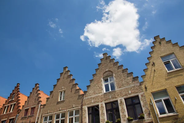 Bruges - The cloud heart over the typically bick houses of the town. — Stock Photo, Image