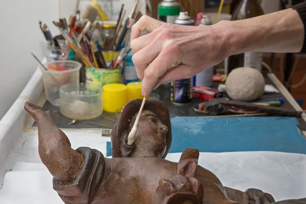 Restoration of angels - detail of hands at work — Stock Photo, Image