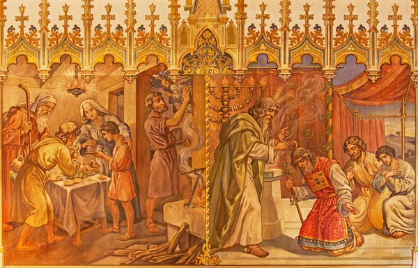 TRNAVA, SLOVAKIA - OCTOBER 14, 2014: The fresco of the scenes Moses and Aron, and Israelites at the Pesach supper at the Lord's Passover by Leopold Bruckner (1905 - 1906) in St. Nicholas church. — Stock Photo, Image