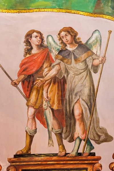 SEVILLE, SPAIN - OCTOBER 28, 2014: The baroque fresco of archangel Raphael and Tobias in church Hospital de los Venerables Sacerdotes by Juan de Valdes Leal (1622 - 1690). — Stock Photo, Image