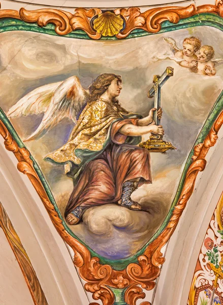 SEVILLE, ESPANHA - OUTUBRO 28, 2014: O afresco barroco de anjo com a cruz simbólica na igreja Hospital de los Venerables Sacerdotes por Juan de Valdes Leal (1622 - 1690 ). — Fotografia de Stock