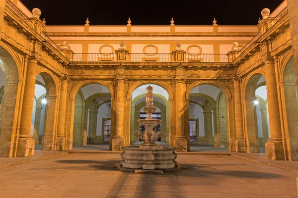 Seville - The atrium of University fromer Tobacco Factory at night. — Stock Photo, Image