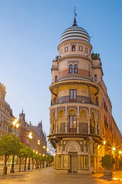 SEVILLE, SPAIN - OCTOBER 29, 2014: The building in the neo-mudejar style on Avenida de la Constitucion street in morning dusk. — Stock Photo, Image