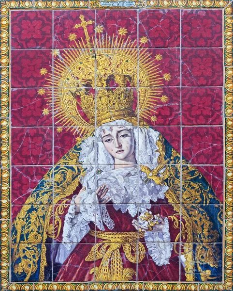 SEVILLE, SPAIN - OCTOBER 29, 2014: The ceramic tiled cried Madonna (Lady of Sorrow) on the facade of church Iglesia los Terceros by A. Morilla from 20. cent. — Stock Photo, Image