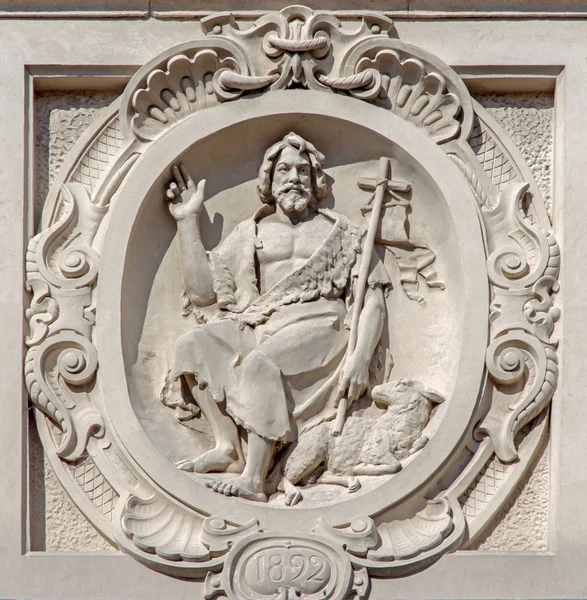 Bruges - The relief of st. John the Baptist on he facade of baroque Carmelites church. — Stock Photo, Image