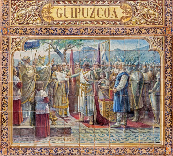 SEVILLE, ESPAÑA - 27 DE OCTUBRE DE 2014: El Guipúzcoa como una de las "alcobas provinciales" de azulejos a lo largo de las murallas de la Plaza de España (1920) de Domingo Prida . —  Fotos de Stock