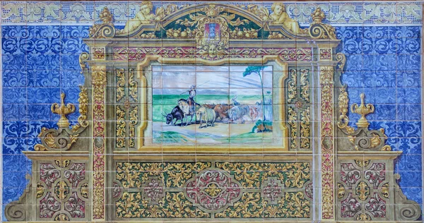 SEVILLE, SPAIN - OCTOBER 28, 2014: The cattle herder image as one part of The tiled 'Province Alcoves' along the walls of the Plaza de Espana (1920s) realized by Domingo Prida. — Stock Photo, Image