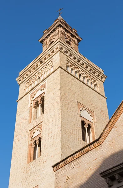 Sevilla - kyrkans torn av San Marcos i mudejarstil stil. — Stockfoto