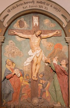 BANSKA STIAVNICA, SLOVAKIA - FEBRUARY 5, 2015: The carved relief of Crucifixion as the part of baroque Calvary from years 1744 - 1751.