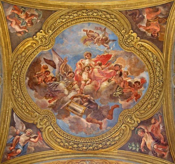 ROME, ITALY - MARCH 25, 2015: The fresco of virtue Charity on the little cupola of side nave in church Basilica dei Santi Ambrogio e Carlo al Corso by Francesco Rosa (1678 - 81). — Stock Photo, Image