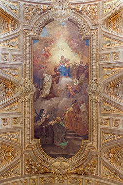 ROME, ITALY - MARCH 26, 2015: The ceiling freso with Madonna and Simon Stock by Pietro Paolo Baldini from 1637. cent. in church Chiesa di Santa Maria in Transpontina.