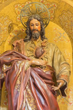 GRANADA, SPAIN - MAY 29, 2015: The the carved statue of The Heard of Jesus in church Nuestra Senora de las Angustias by Josr de Mora (17. cent.). clipart