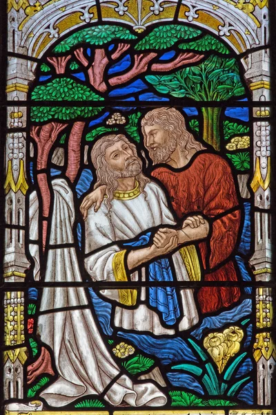 JERUSALEM, ISRAEL - MARCH 5, 2015: The baptism of Christ scene on the windowpane in st. George anglicans church from end of 19. cent. — Stockfoto