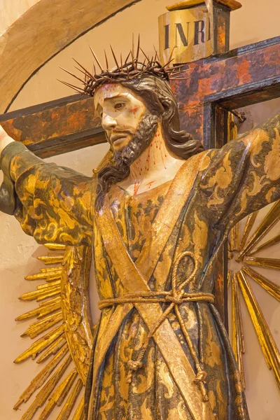 GRANADA, SPAIN - MAY 29, 2015: The stylized Jesus Christ on the cross as the priest in Iglesia de san Anton. — Stock Photo, Image