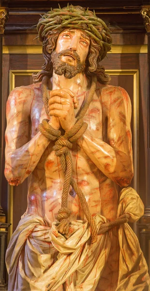 GRANADA, SPAIN - MAY 29, 2015: The tortured Jesus Christ in Bond statue in church Iglesia de los santos Justo y Pastor. — Stock Photo, Image