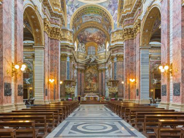 ROME, ITALY - MARCH 25, 2015: The nave of baroque church Basilica dei Santi Ambrogio e Carlo al Corso.