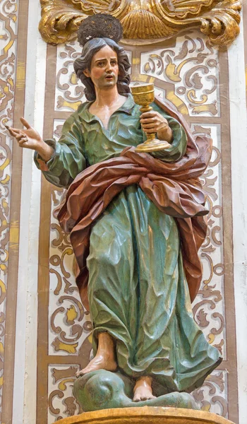 Granada, Spanje - 29 mei 2015: Het gesneden beeld van st. Johannes de apostel in de kerk Nuestra Señora de las Angustias door Pedro Duque Cornejo (1718). — Stockfoto