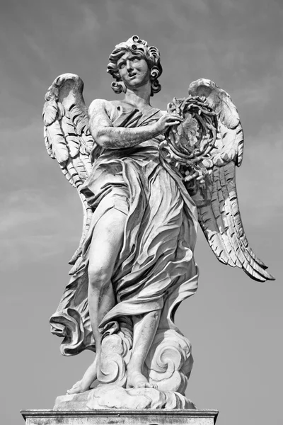 ROME, ITALY - MARCH 27, 2015: Ponte Sant'Angelo - Angels bridge - Angel with the crown of thorns G. L. Bernini and son Paolo. (original at Sant'Andrea delle Fratte, copy by Paolo Naldini) Stock Photo