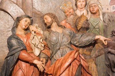 BANSKA STIAVNICA, SLOVAKIA - FEBRUARY 5, 2015: The detail of carved relief Jesus says farewell to his mother as the part of baroque Calvary from years 1744 - 1751 by Dionyz Stanetti.