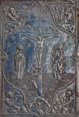 BETHLEHEM, ISRAEL - MARCH 6, 2015: The detail of the metal binding of liturgical book from 19. cent. in Syrian orthodox church with the Crucifixion of Christ.