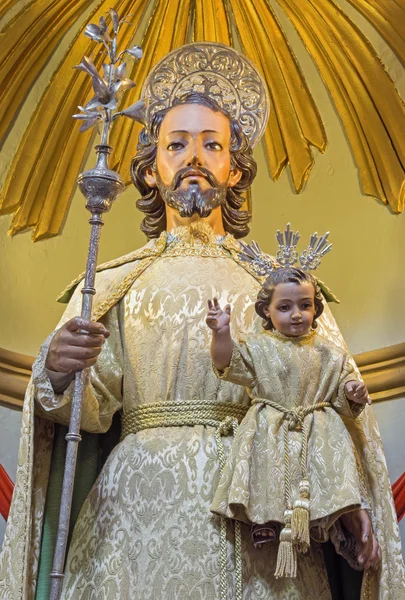 CORDOBA, SPAIN - MAY 26, 2015: St. Joseph traditional vested statue in Church Eremita de Nuestra Senora del Socorro on side altar by Juan Morilo from 18. cent. — Stock fotografie