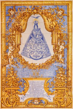 CORDOBA, SPAIN - MAY 26, 2015: The ceramic tiled Madonna (Nuestra Senora del Socorro) by artist M. Tienda from 20. cent. on the street near the Plaza de la Corredera square.