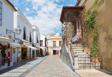 CORDOBA, SPAIN - MAY 256, 2015: The street beside of Cathedral walls.