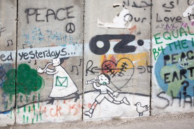 BETHLEHEM, ISRAEL - MARCH 6, 2015: The Detail of graffitti on the Separation barrier.