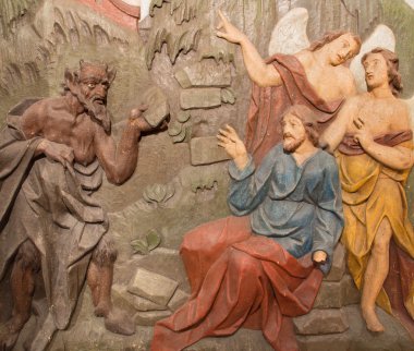 BANSKA STIAVNICA, SLOVAKIA - FEBRUARY 5, 2015: The carved relief of Temptation of Jesus on the desert as the part of baroque Calvary from years 1744 - 1751 by Dionyz Stanetti.