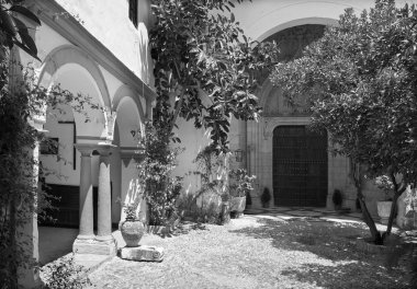 CORDOBA, SPAIN - MAY 26, 2015: The atrium and late gothic potal on church of monastery Convento Santa Marta.