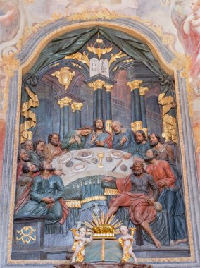 BANSKA STIAVNICA, SLOVAKIA - FEBRUARY 20, 2015: The carved polychrome relief of Last supper and altar in lower calvary church from 18. cent. by unknown artist.