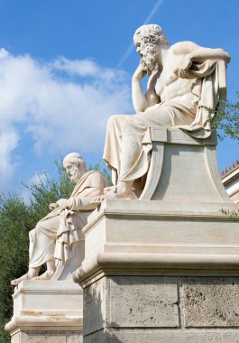 Athens - The statue of Plato  in front of National Academy building by the Italian sculptor Piccarelli (from 19. cent.) and the Athena statue on the background.