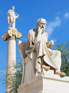 Athens - The statue of Socrates in front of National Academy building by the Italian sculptor Piccarelli (from 19. cent.) and the Apollo statue on the Background.