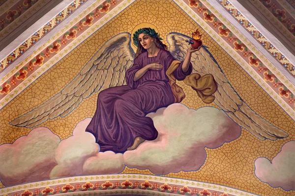 BANSKA STIAVNICA, SLOVAKIA - FEBRUARY 5, 2015: The angel with the hart with the flames on the ceiling of parish church from year 1910 by P. J. Kern. — Stock Photo, Image