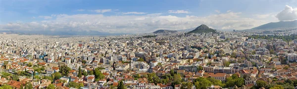 ATENAS, GRÉCIA - OUTUBRO 8, 2015: O panorama da Acrópole até a colina de Likavittos e a cidade . — Fotografia de Stock