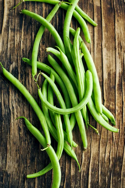 Fresh green beans on wooden background — Stock Photo, Image