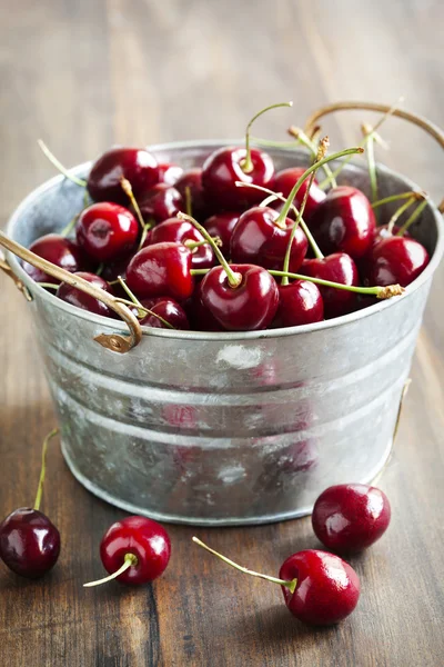 Sweet cherry in metal bucket — Stock Photo, Image