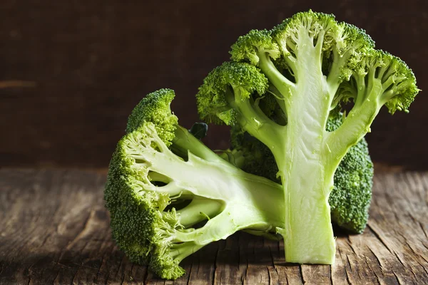 Fresh broccoli on wooden background — Stock Photo, Image